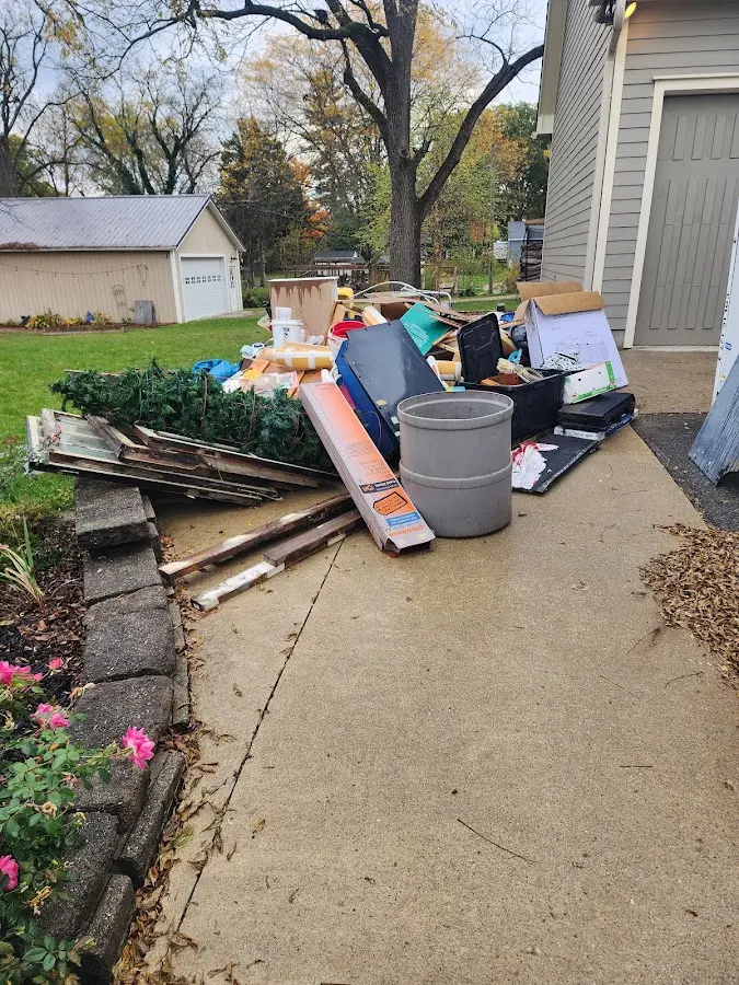 Dumpster being loaded with debris for 3 Yard Dumpster Rental in Whiskey Creek
